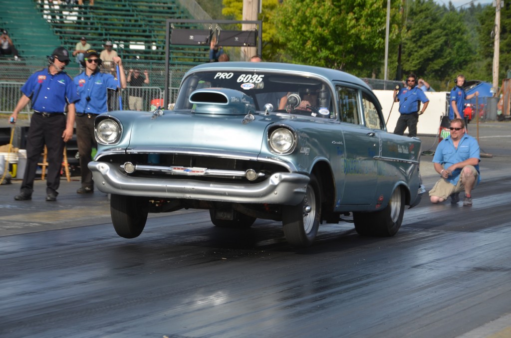 First pass, left lane, June 5th 2013 10.845 @ 124.00 - 1.498 60 foot Chris Young, crew chief, behind car checking wheelie bars. Click to enlarge