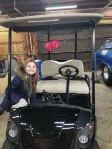 Peyten with the Yamaha Golf Cart