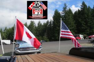 Flying the U.S. & Canadian flags in our pit area